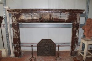Antique gray sandstone fireplace